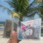 Which currency do locals use in Antigua?