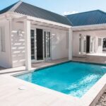 In Jolly Harbour, what's the cost per square foot for homes with private pools