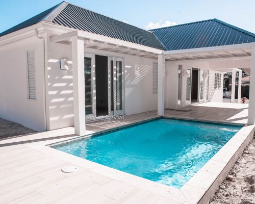 In Jolly Harbour, what's the cost per square foot for homes with private pools